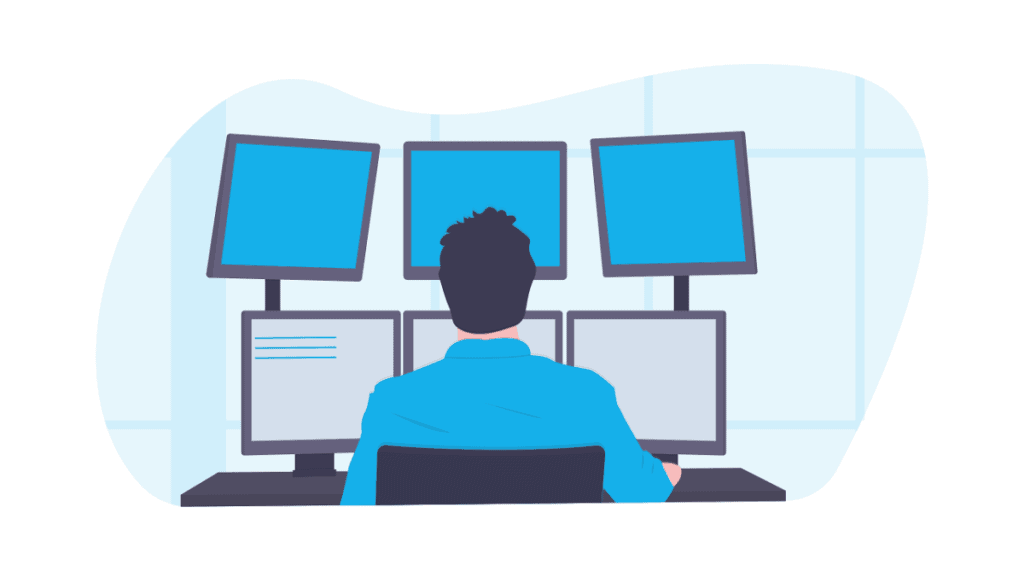 node.js vs python - man sitting in front of monitors