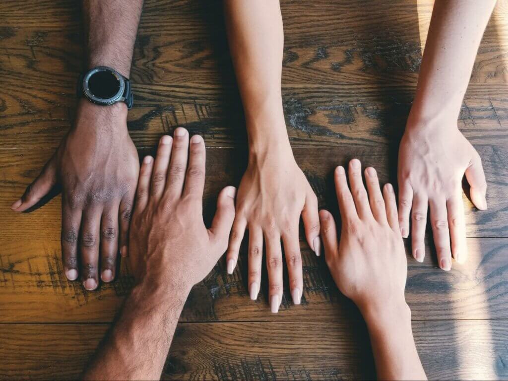 hands representing diversity – in order to get rid of racial stereotypes, we need to represent different minority groups