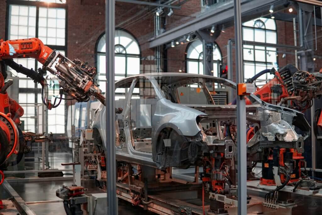 Robotic automotive production line showing how generative AI in Manufacturing supports automation and factory workflows.