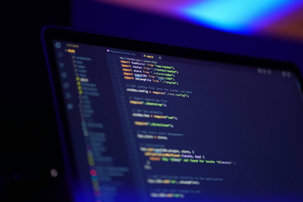 Close-up of a computer screen with colorful code lines, illustrating bespoke software development services and custom programming.